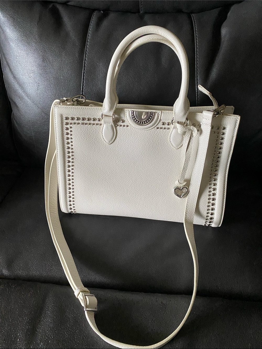 Elegant Cream Satchel with Stud Accents and Heart Charm